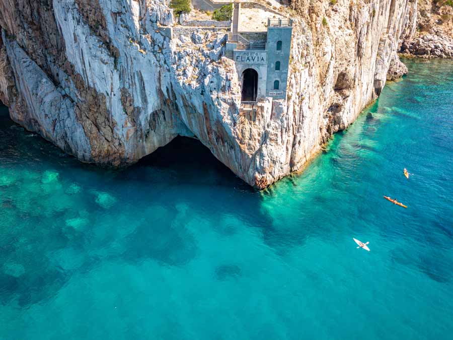 Aerial view of sea and coastline, Sardinia, Italy. Porto Flavia, kayaks